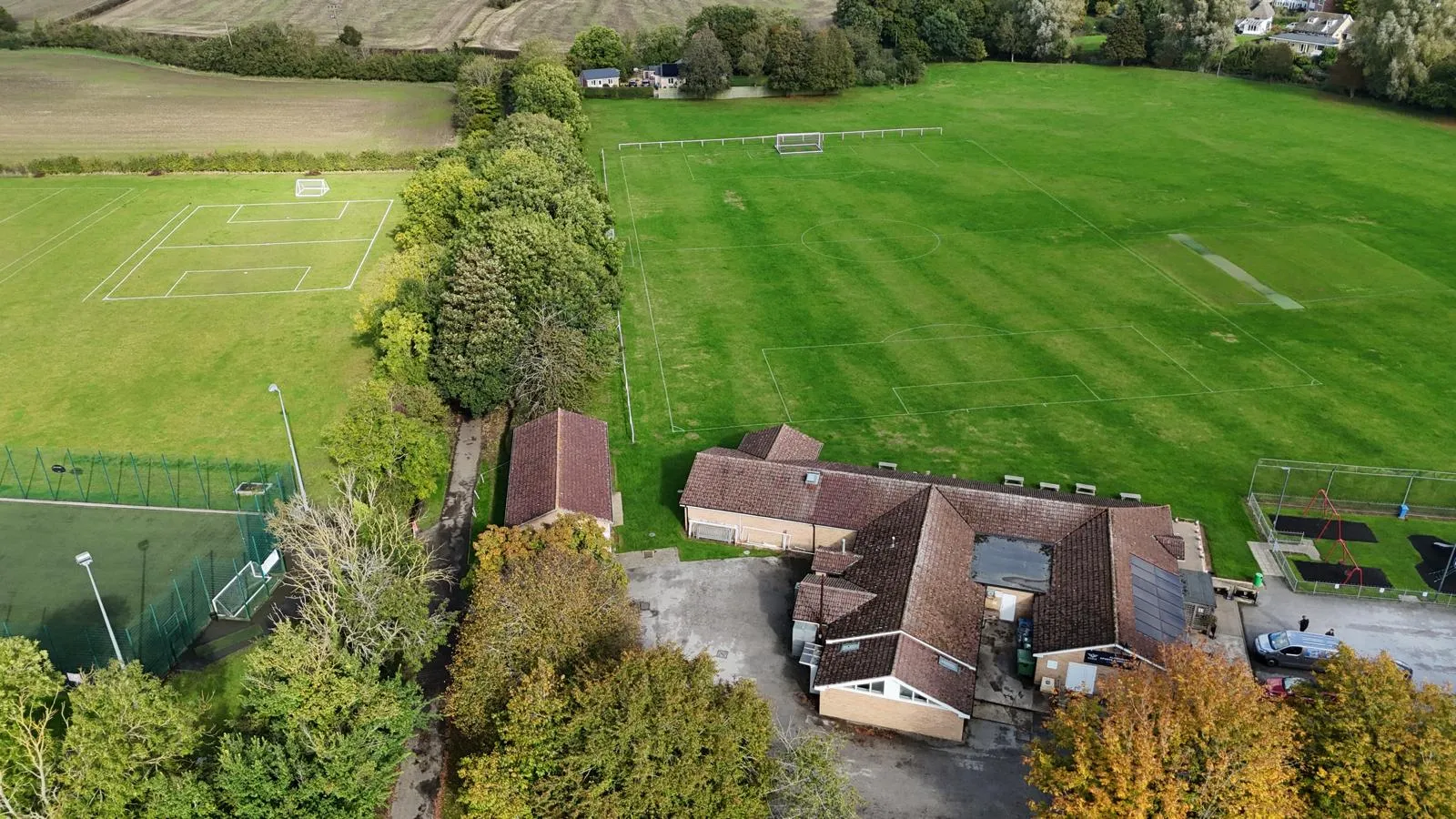 Aerial view of the recreation field: the floodlit all-weather pitch, the Pavilion and the grass pitches